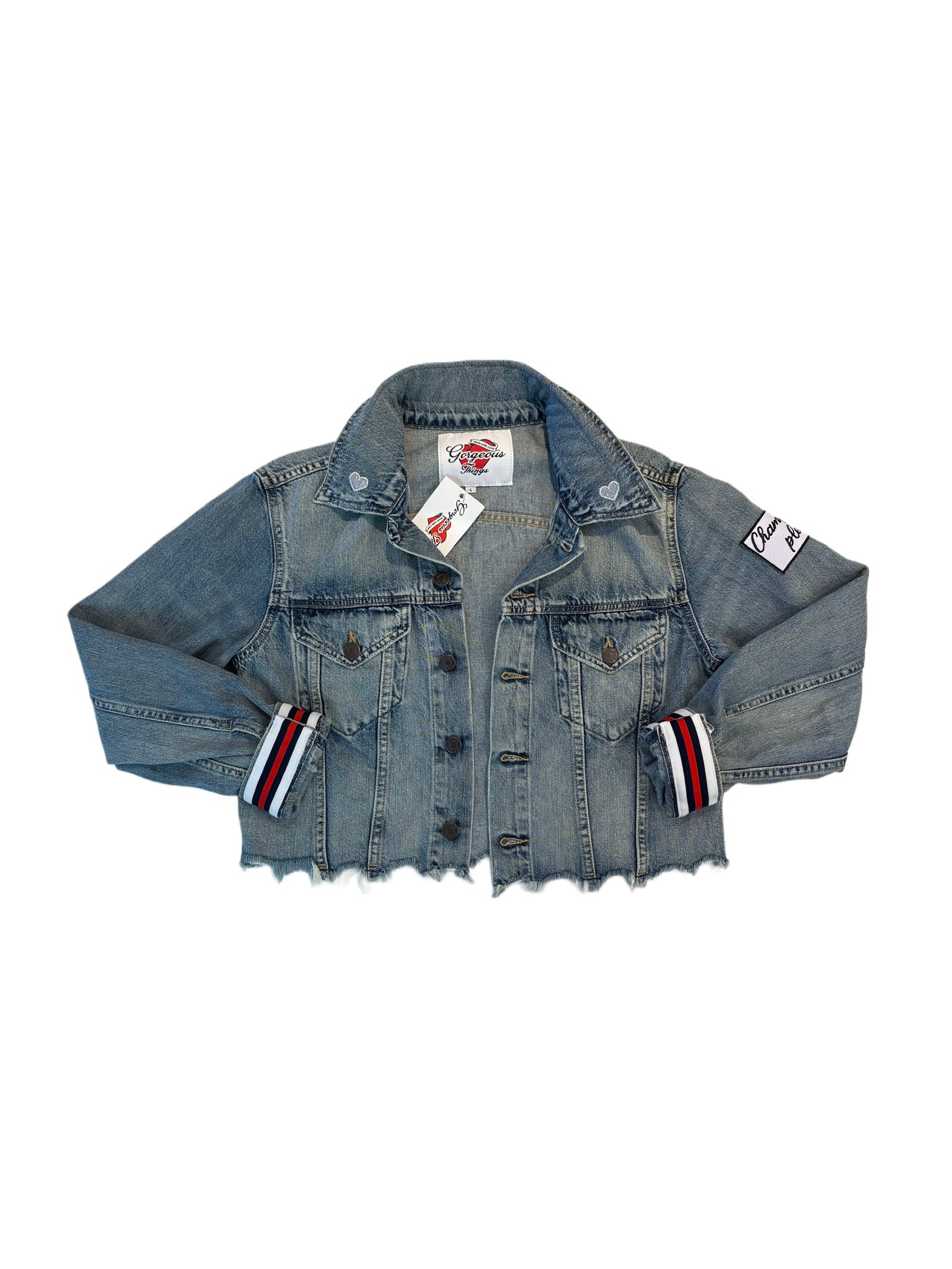 Blue denim jacket with brand labels on a white background