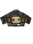 Camouflage-patterned product with a gold logo on a white background